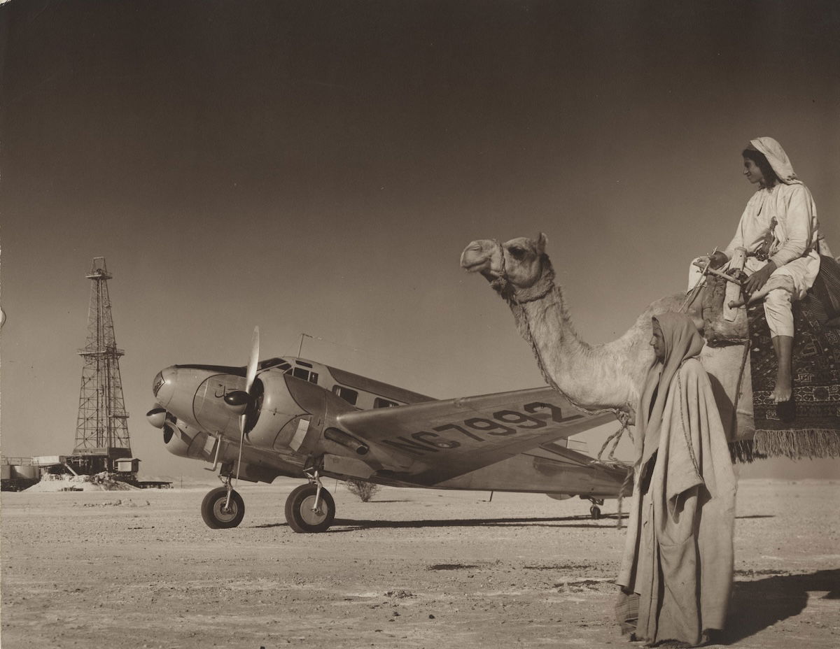 Arabian American Oil Co drilling rig in the desert, Saudi Arabia, by Robert Yarnall Richie, 1948. DeGolyer Library, Southern Methodist University. Public Domain.